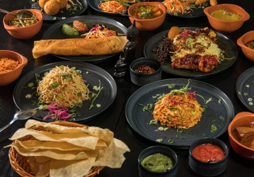 An assortment of Sri Lankan dishes and papadam bread. An assortment of Sri Lankan dishes and papadam bread.